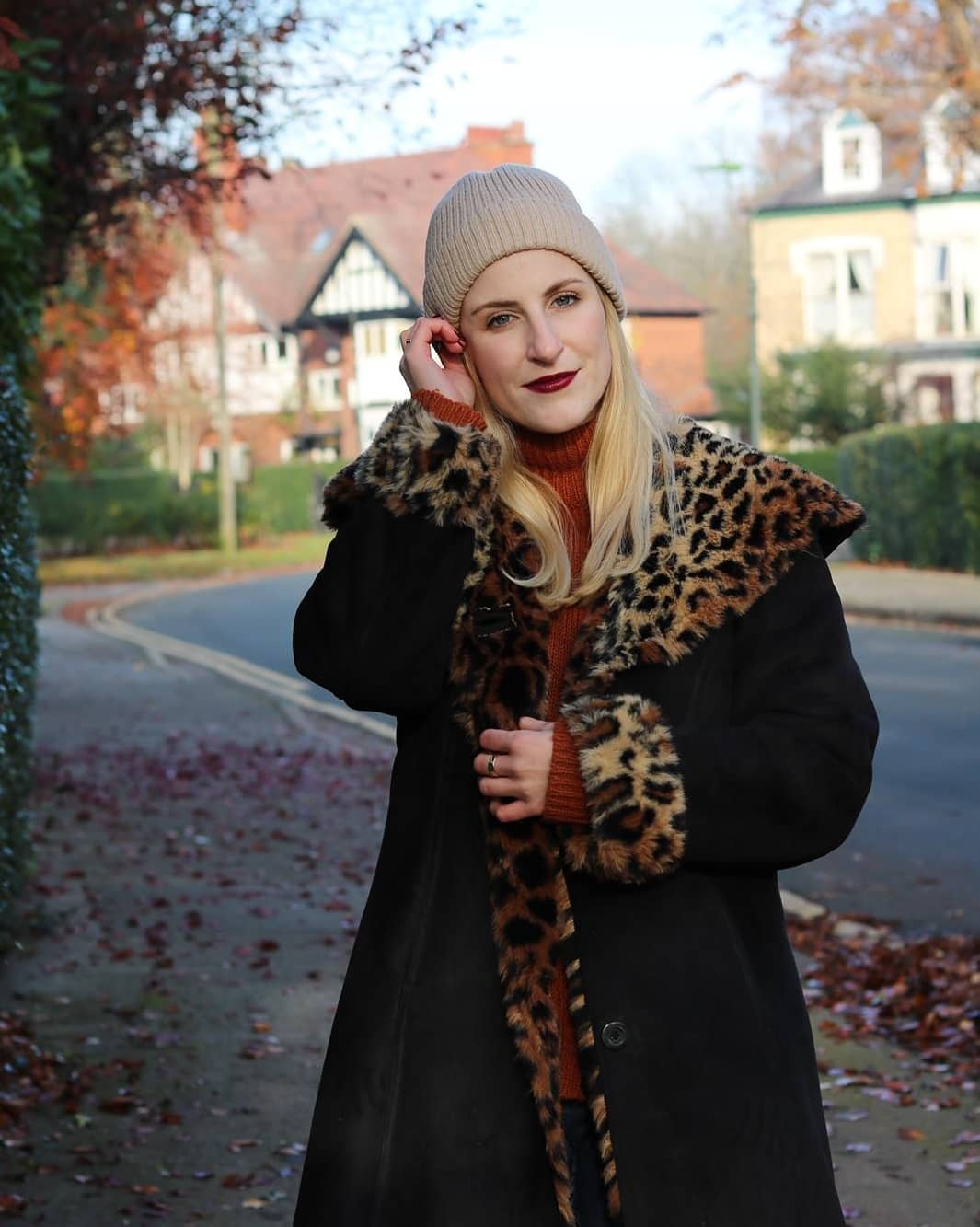 Amy in a vintage black faux suede coat with leopard print faux fur cuffs and collar