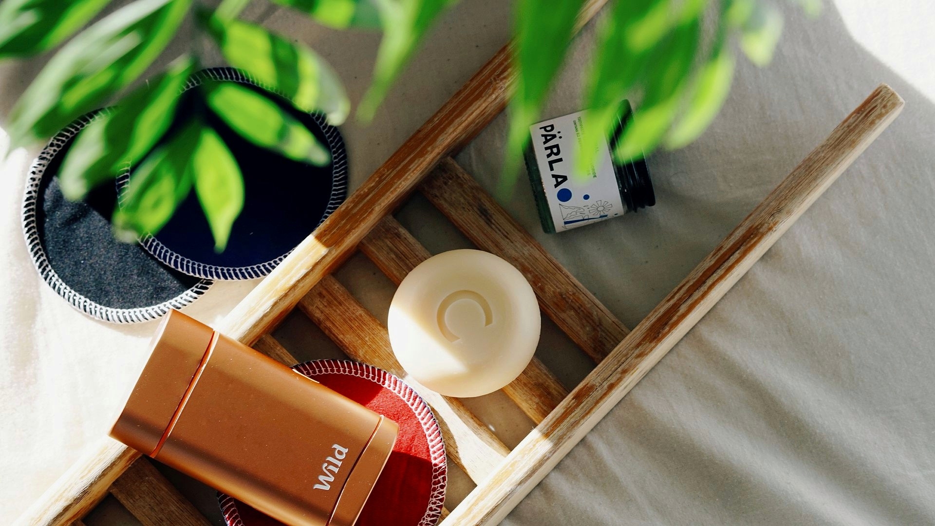 flatlay of Wild deodorant, conditioner bar and toothpaste tabs