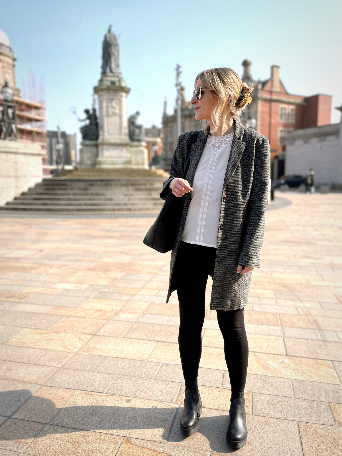 Outfit photo; wearing black leggings with black chelsea boots, a white blouse and a check longline blazer