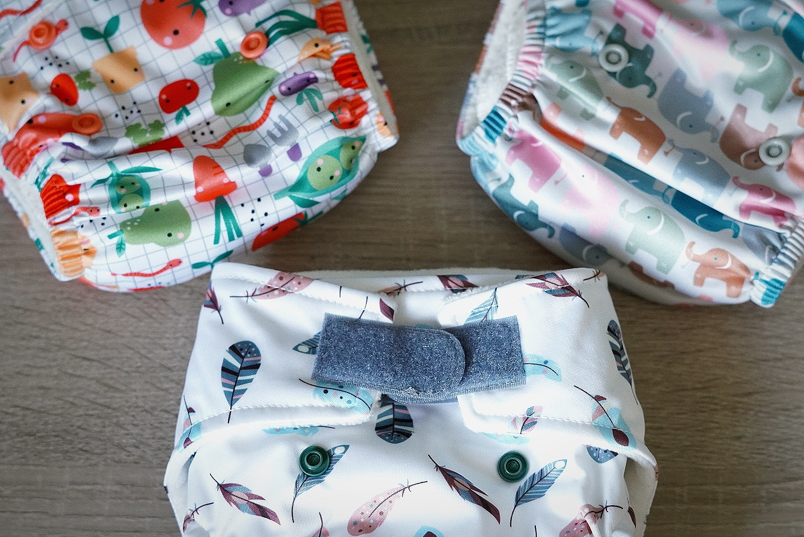 birds eye view of three reusable patterned nappies