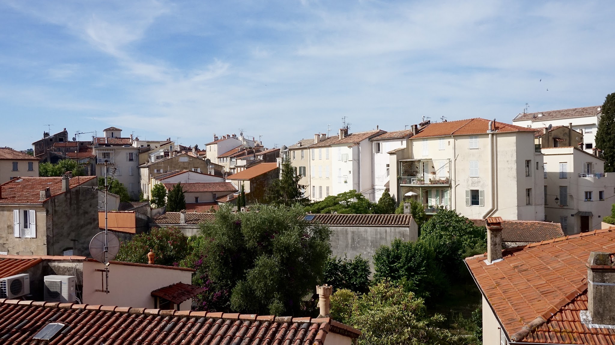 a view over rooftops, blue sky