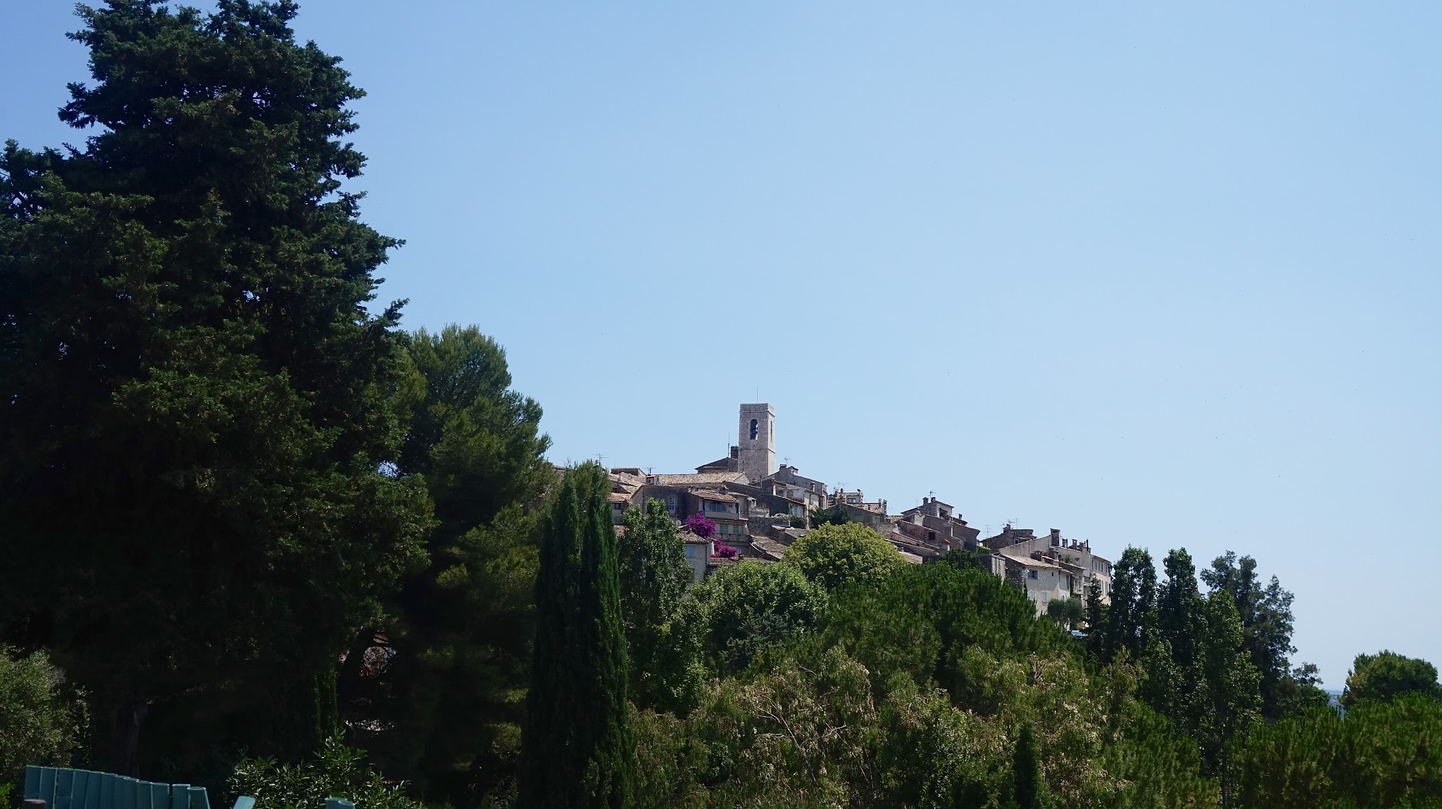 town on a hill among trees