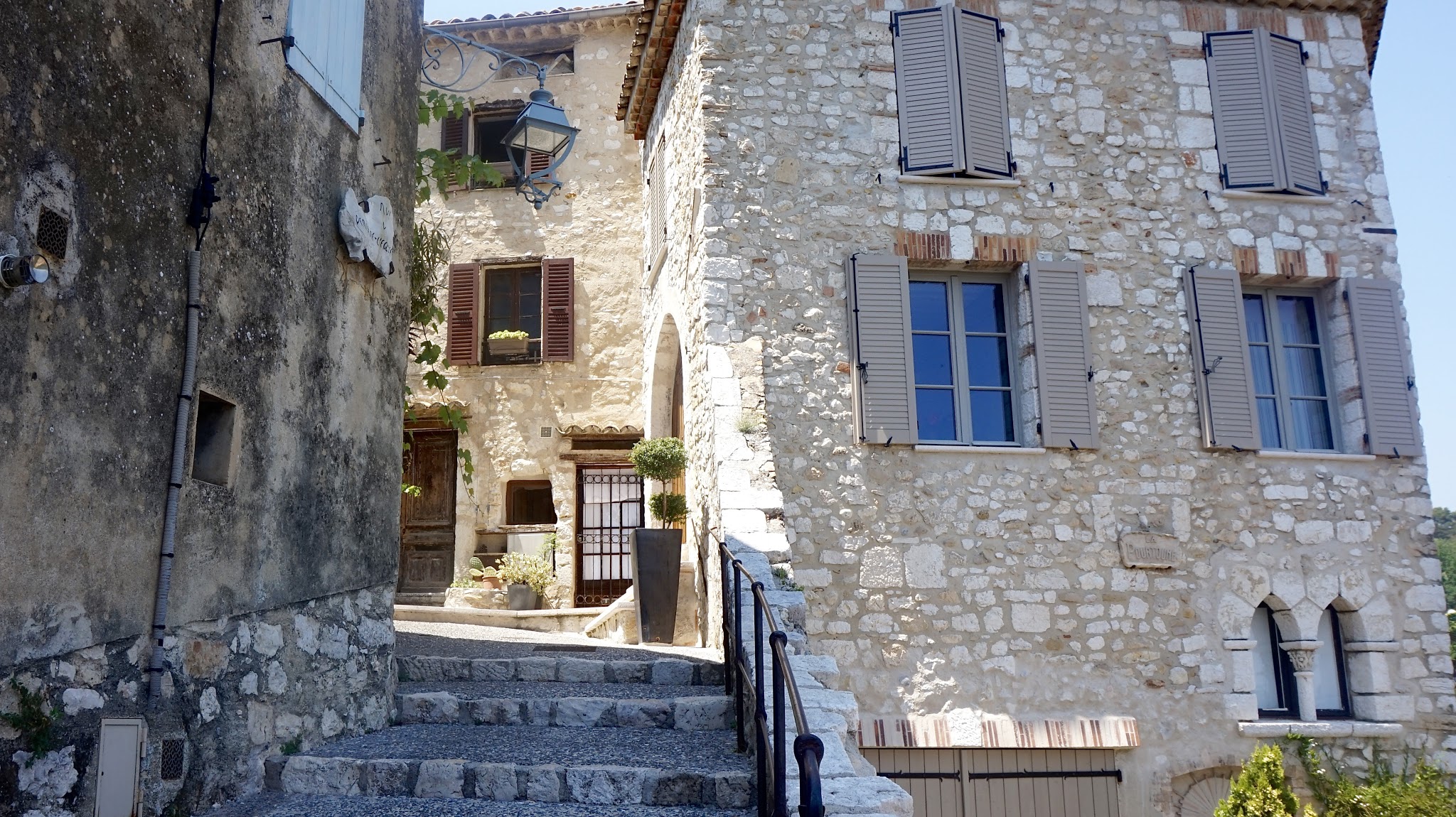 view up a cobbled stone street surround by stone cottages
